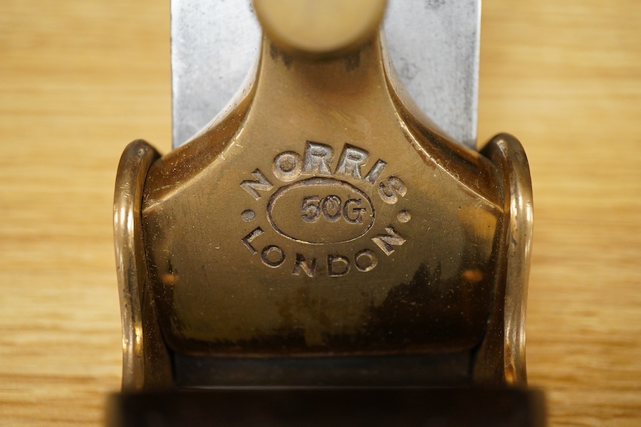 A Norris 50G adjustable gunmetal, steel soled smoothing plane, stamped with Norris, London to both the brass lever cap and the iron, with owner’s name stamped to the handle